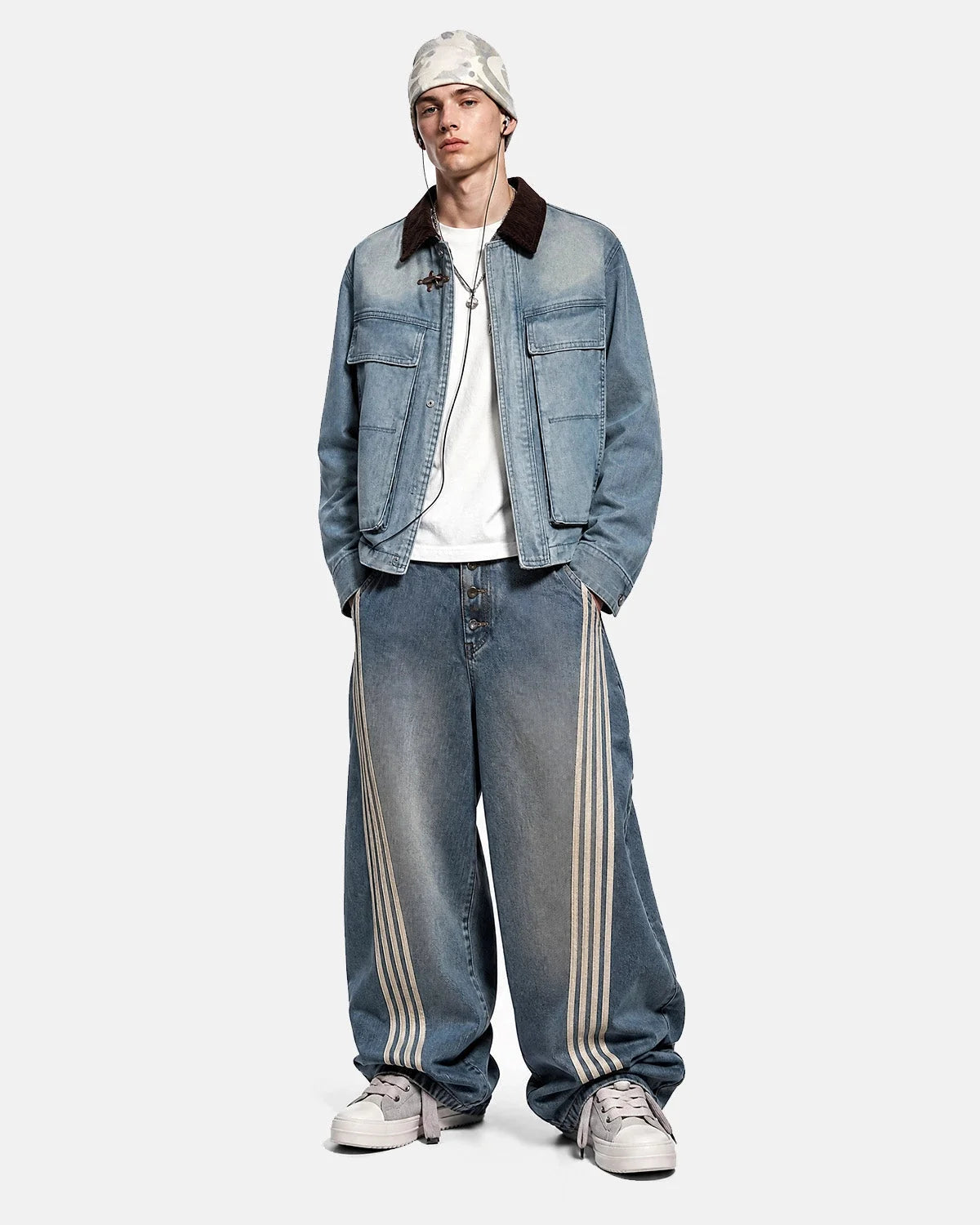 Blue boxy denim jacket with dark corduroy collar, long sleeves and multiple front pockets