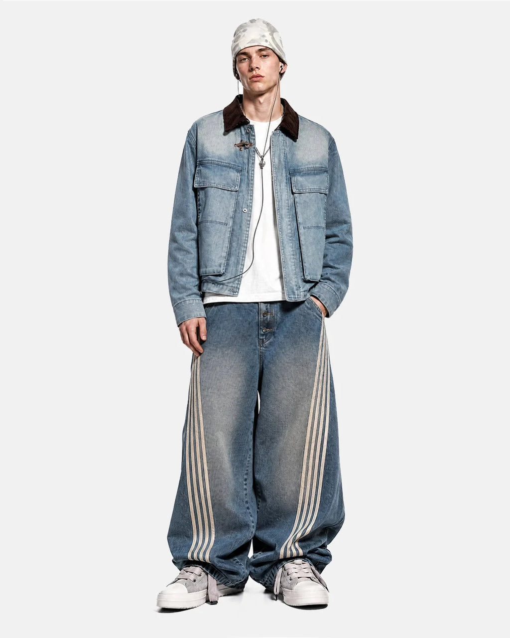 Blue boxy denim jacket with dark corduroy collar, long sleeves and multiple front pockets