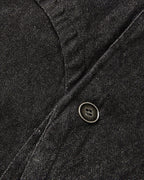 Men's black cropped denim jacket with high collar and asymmetric button front