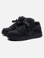 Black high-top skate trainers with textured panels and lace-up fastening