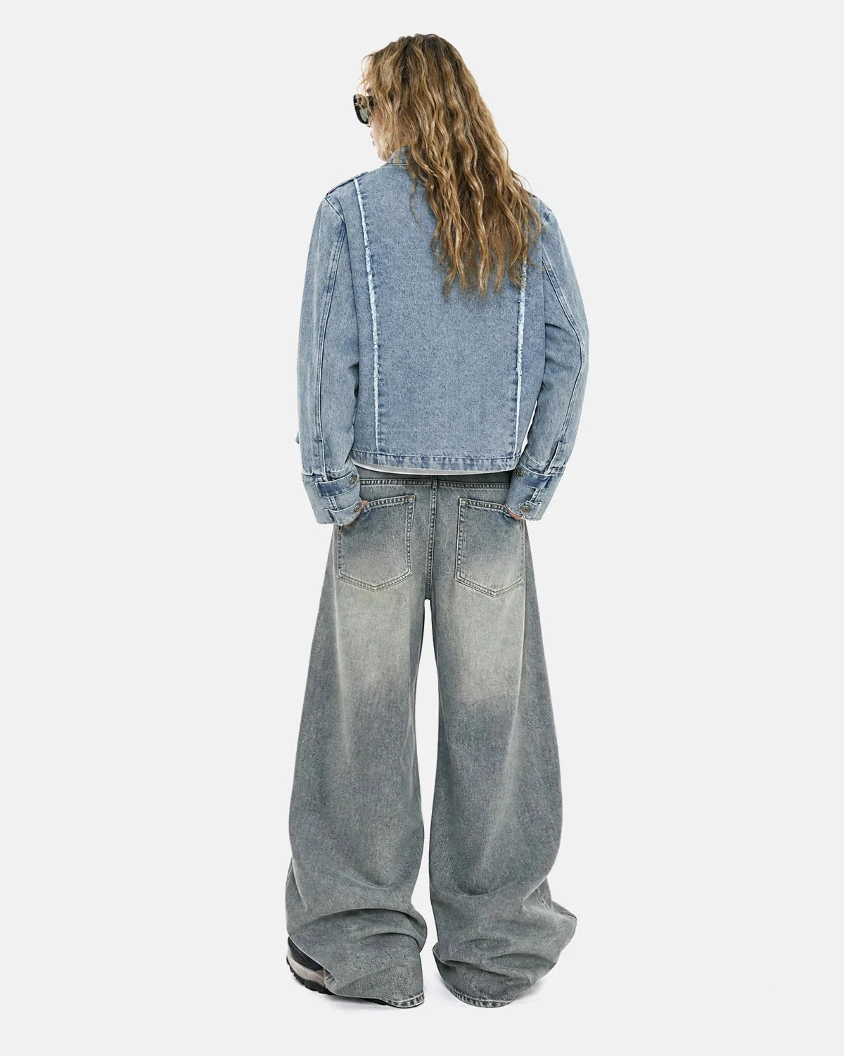 Women's cropped denim jacket with mandarin collar and decorative button tabs