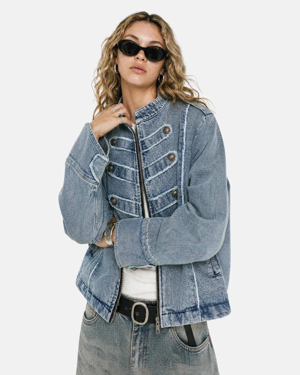 Women's cropped denim jacket with mandarin collar and decorative button tabs
