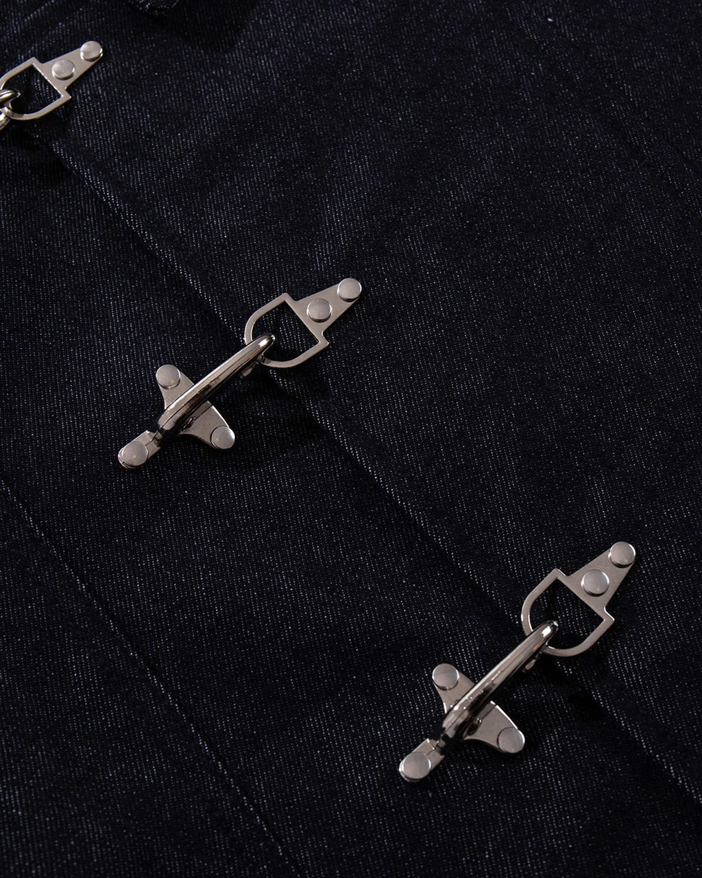 Men's dark blue denim jacket with spread collar and fireman clasp fastenings