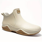 Women's slip-on ankle boot with rounded toe and textured sole