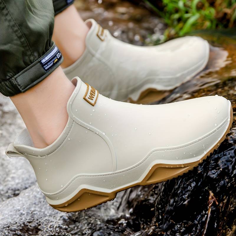 Women's slip-on ankle boot with rounded toe and textured sole