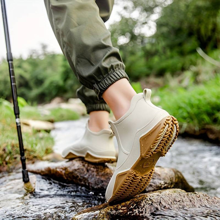 Women's slip-on ankle boot with rounded toe and textured sole