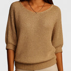 Women's textured knit pullover with round neckline and three-quarter sleeves