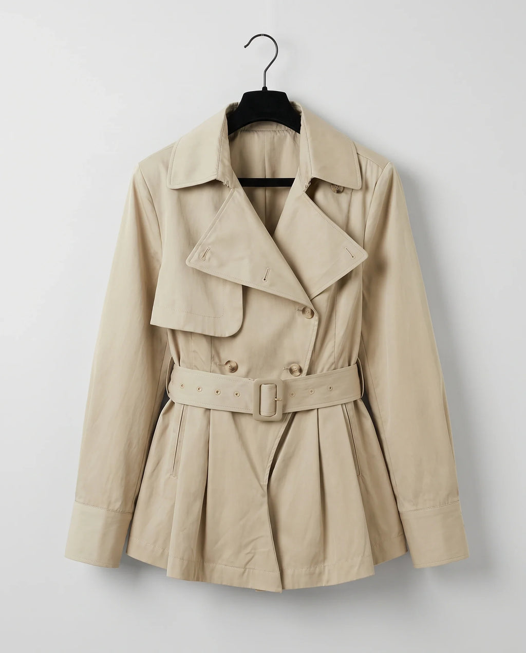 Women's beige belted trench-style playsuit with long sleeves and short legs