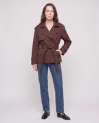 Women's short belted trench jacket with long sleeves and notched collar