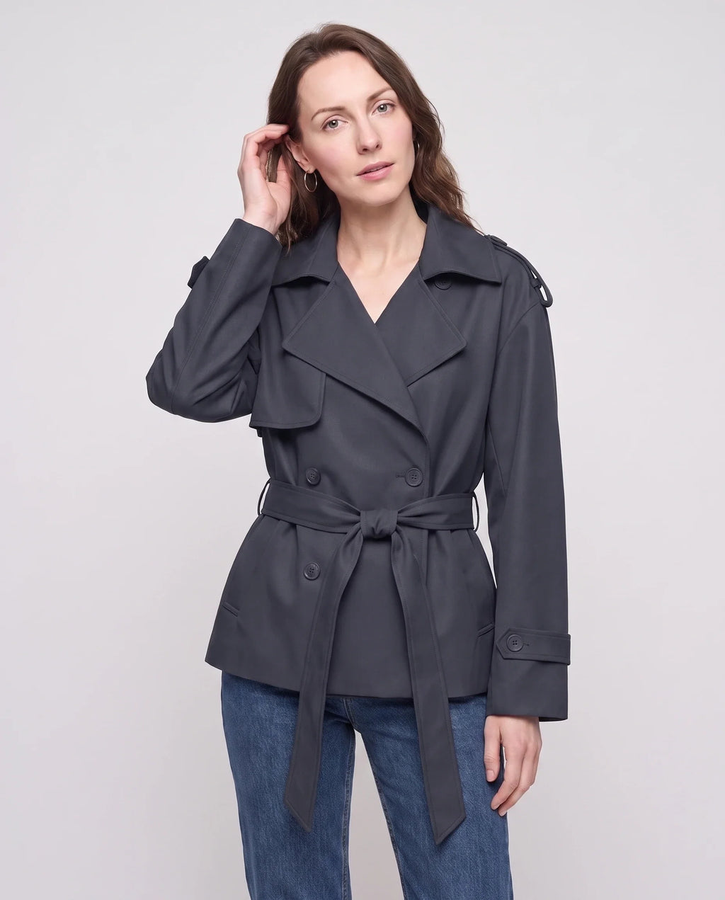 Women's short belted trench jacket with long sleeves and notched collar