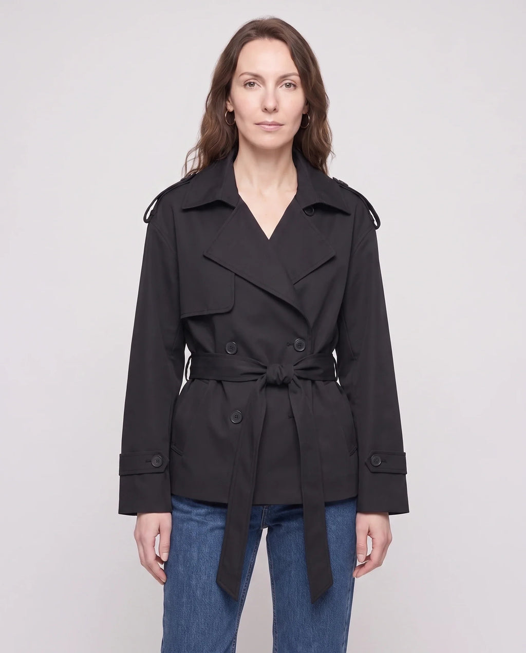 Women's short belted trench jacket with long sleeves and notched collar