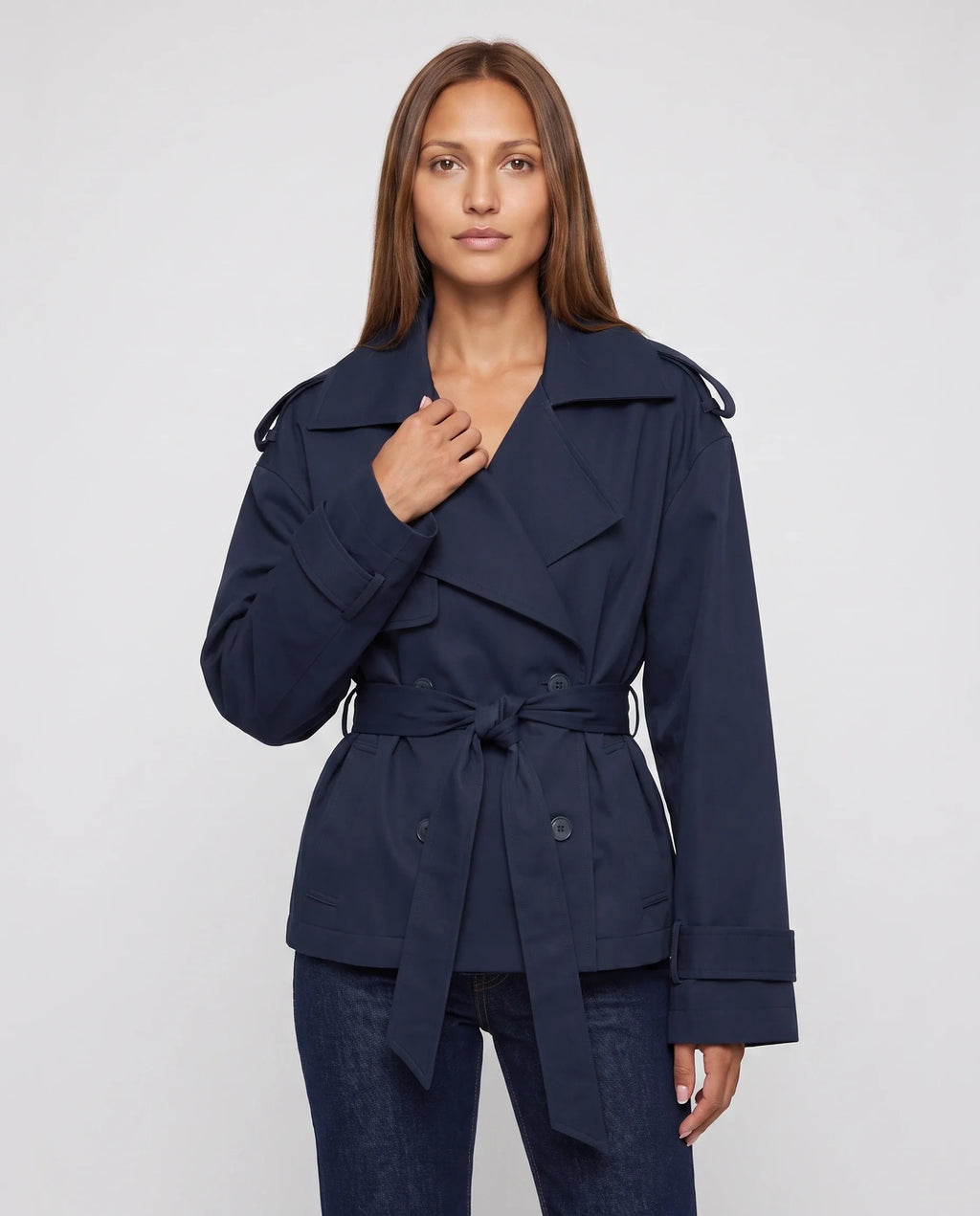 Women's oversized short belted trench jacket with wide lapels and long sleeves