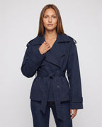 Women's oversized short belted trench jacket with wide lapels and long sleeves