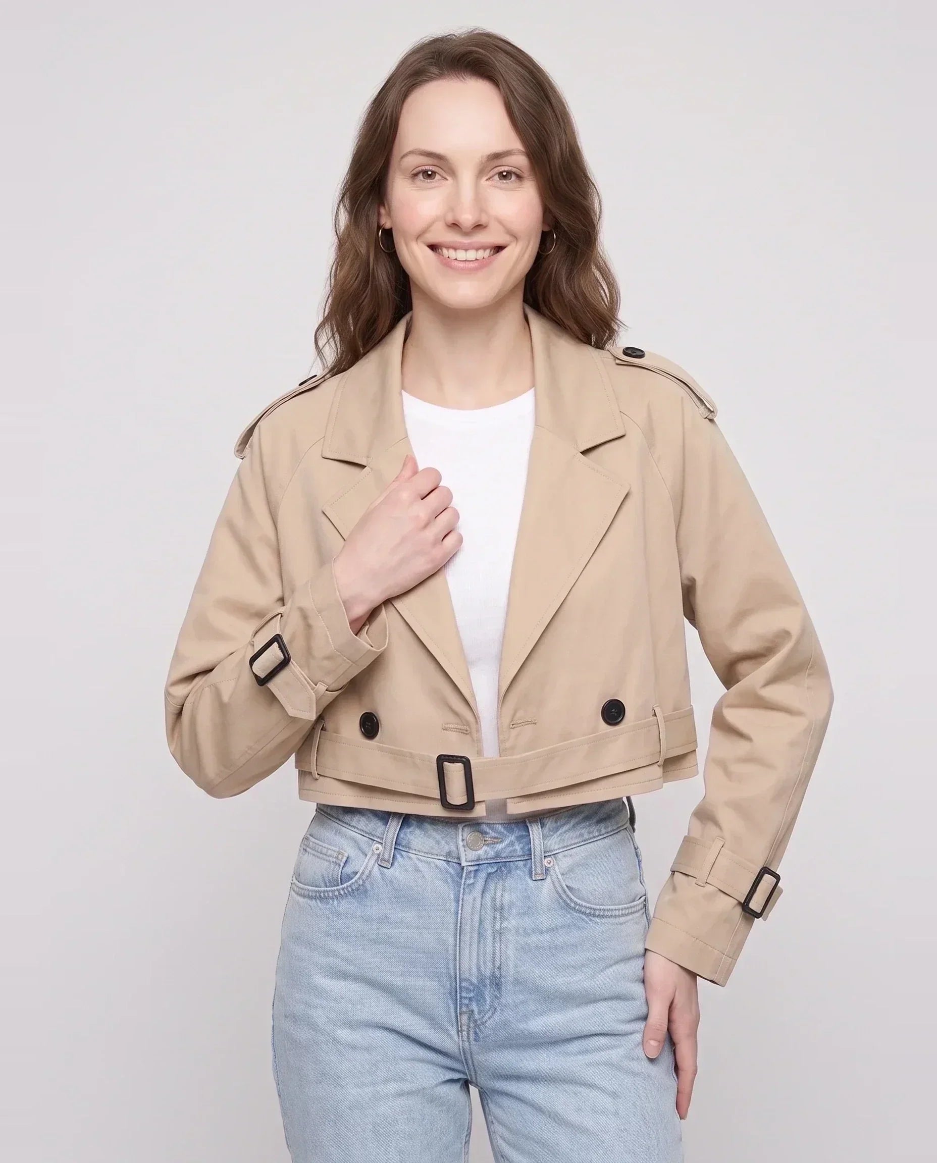 Women's beige cropped trench jacket with belt and buckle cuffs