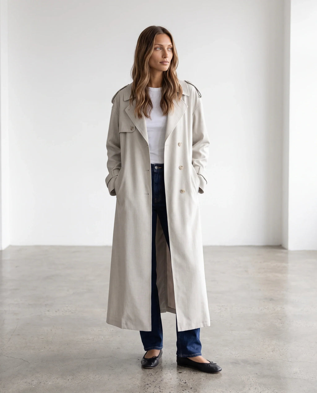Women's cream long trench coat with notched lapels and button front
