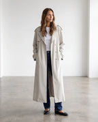 Women's cream long trench coat with notched lapels and button front
