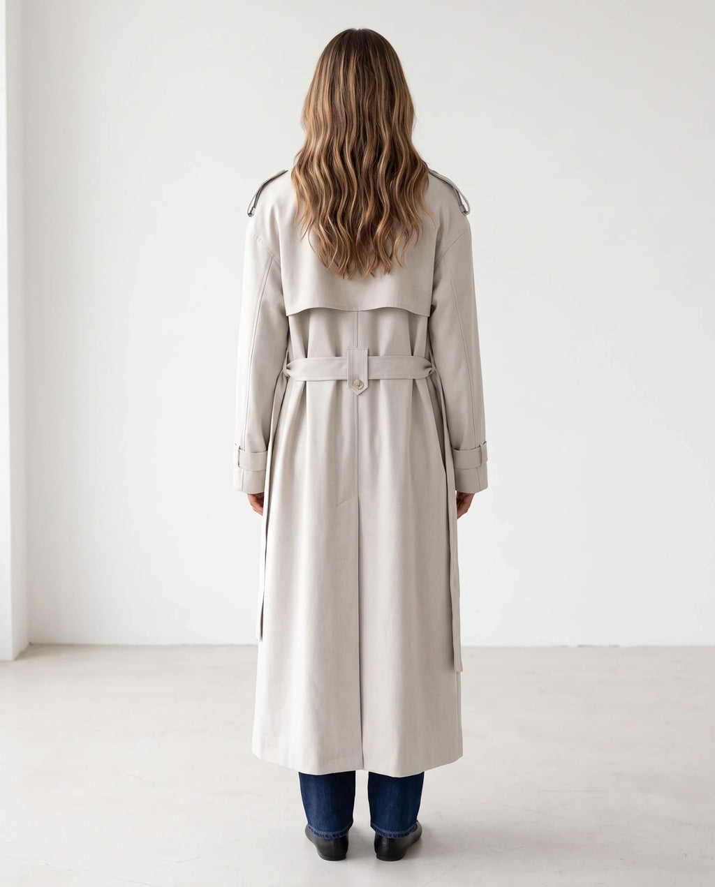 Women's cream long trench coat with notched lapels and button front