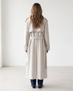 Women's cream long trench coat with notched lapels and button front