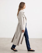 Women's cream long trench coat with notched lapels and button front