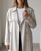 Women's cream long trench coat with notched lapels and button front
