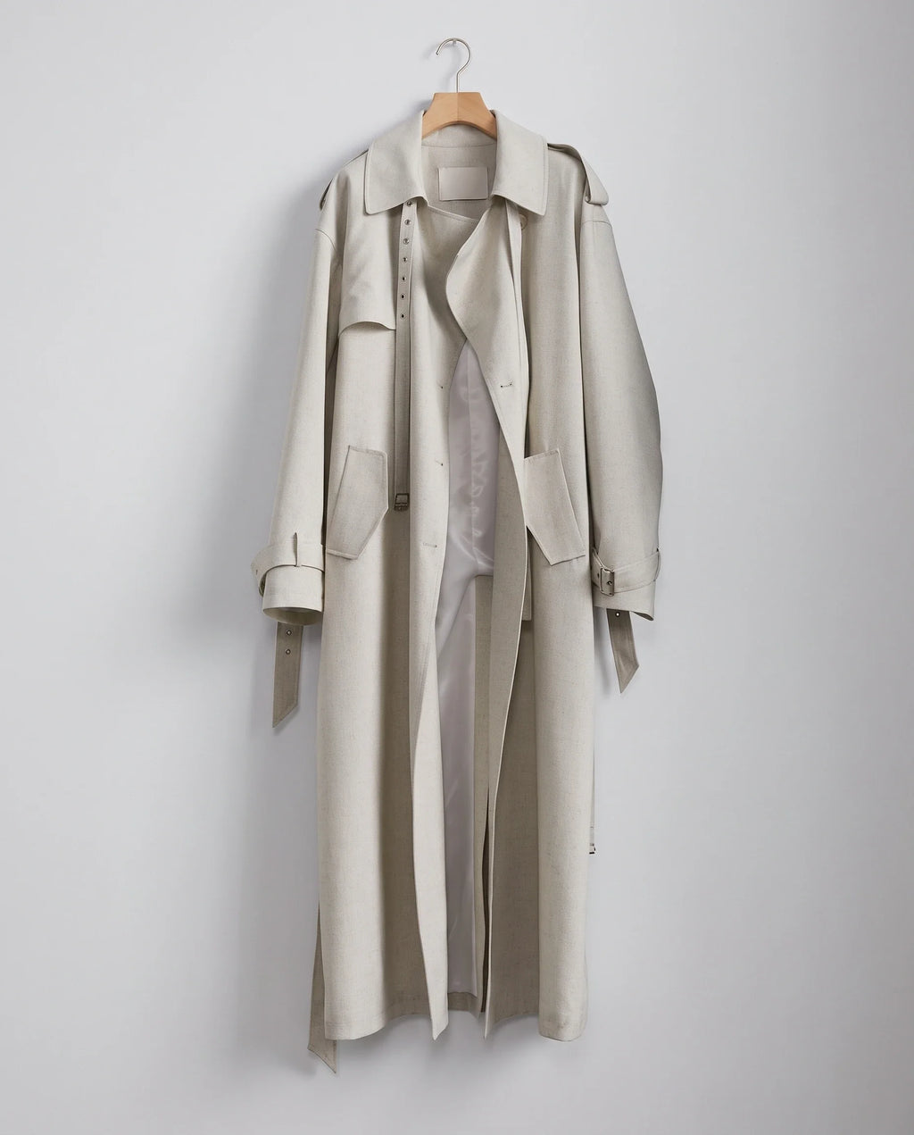 Women's cream long trench coat with notched lapels and button front