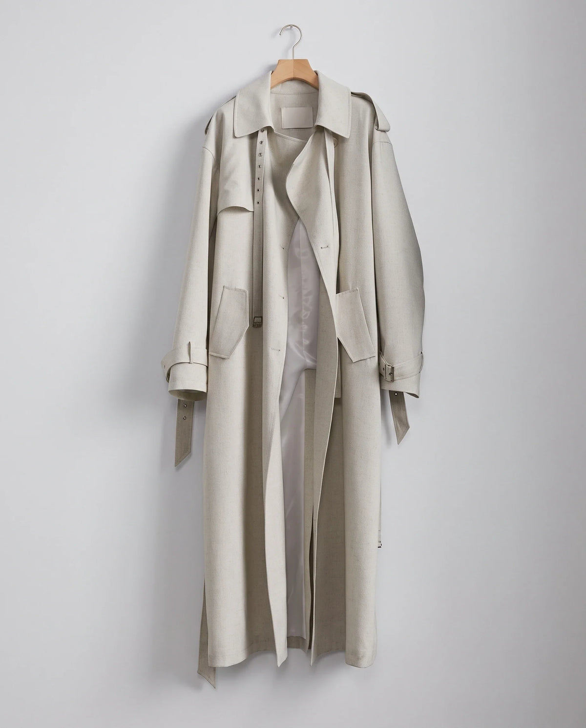 Women's cream long trench coat with notched lapels and button front