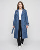 Women's long denim trench coat with lapels, buttons, belt and cuff straps