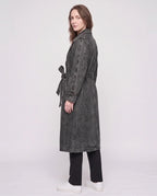 Women's long denim trench coat with lapels, buttons, belt and cuff straps