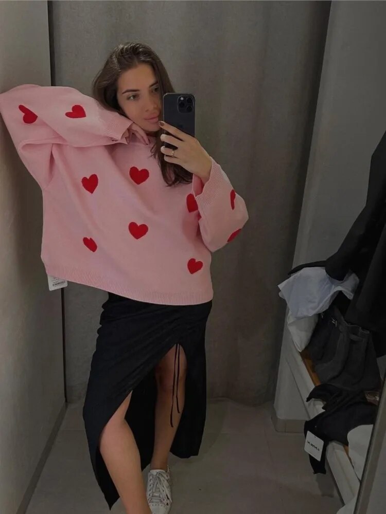 Women's knitted jumper with scattered contrasting motifs