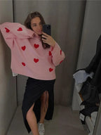 Women's knitted jumper with scattered contrasting motifs