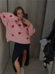 Women's knitted jumper with scattered contrasting motifs