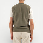 Men's olive green V-neck sweater vest with shoulder buttons