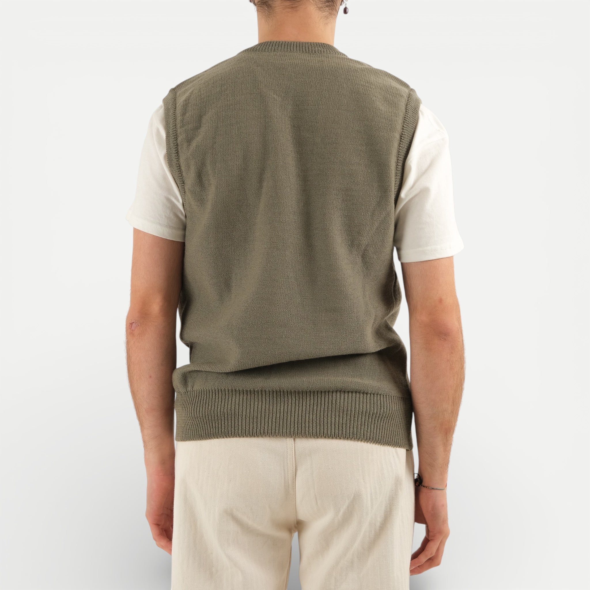 Men's olive green V-neck sweater vest with shoulder buttons
