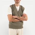 Men's olive green V-neck sweater vest with shoulder buttons