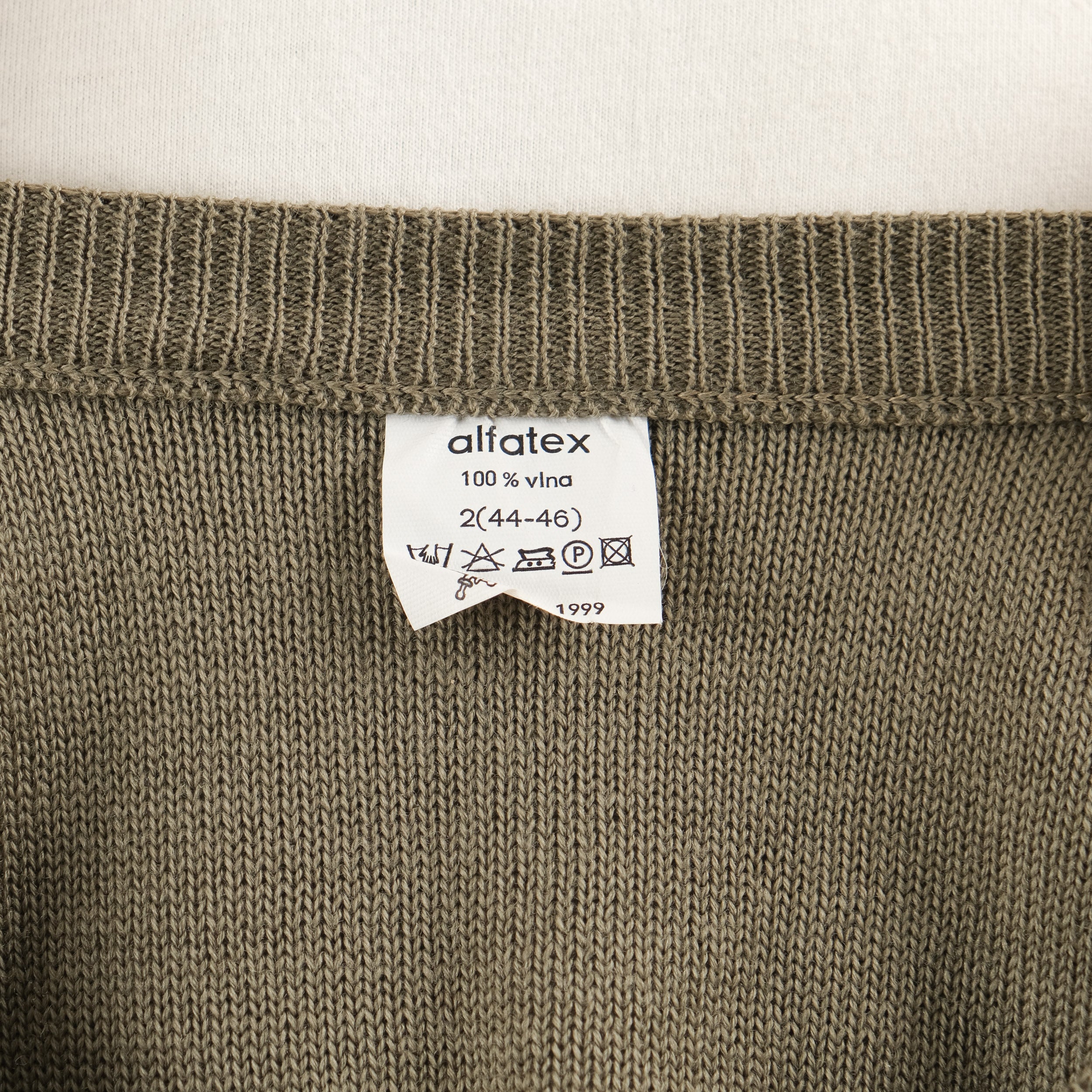 Men's olive green V-neck sweater vest with shoulder buttons