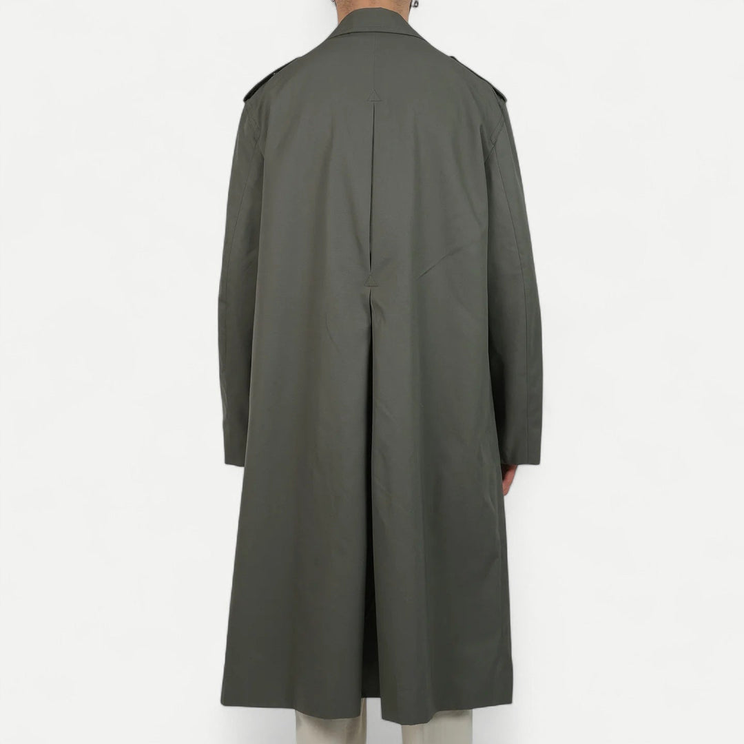 Men's muted green long raincoat with button front, pointed collar and shoulder tabs