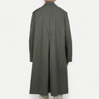 Men's muted green long raincoat with button front, pointed collar and shoulder tabs