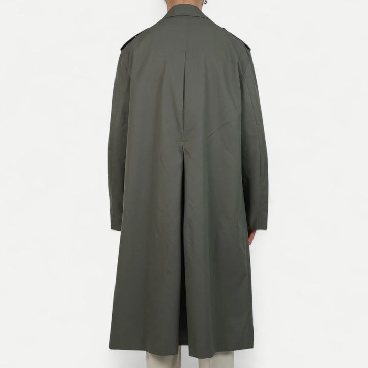 Men's muted green long raincoat with button front, pointed collar and shoulder tabs