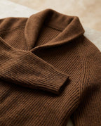Men's ribbed knit cardigan with shawl-style collar, buttons and patch pockets