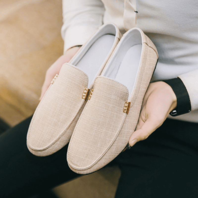 Men's slip-on loafers with gold-tone metal detail and flat sole