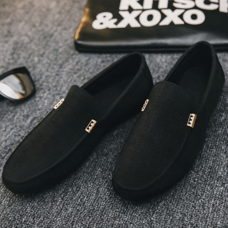 Men's slip-on loafers with gold-tone metal detail and flat sole