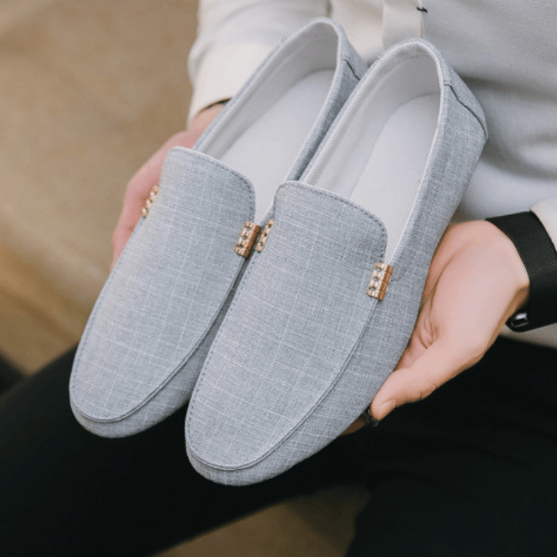 Men's slip-on loafers with gold-tone metal detail and flat sole