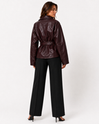 Women's belted collared leather jacket with zip pockets