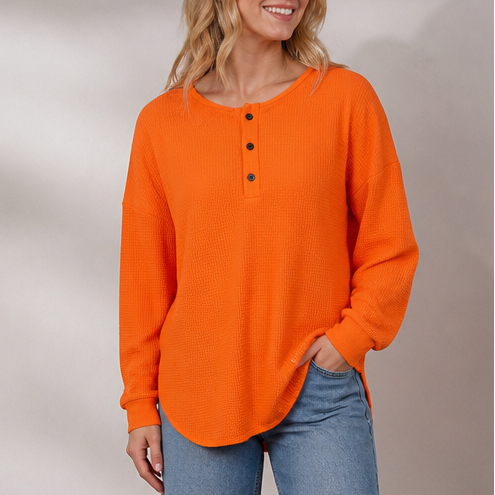 Women's waffle knit henley top with long sleeves and button placket