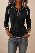 Women's long-sleeve waffle knit Henley top with contrast stitching and button placket