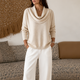 Women's cowl neck knit sweater with long sleeves and ribbed hem