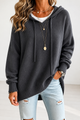 Women's oversized hooded knit sweater with drawstring ties
