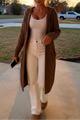 Women's longline hooded cable knit cardigan with long sleeves and front pockets