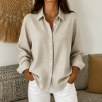 Women's checked button-down shirt with pointed collar, long sleeves and curved hem