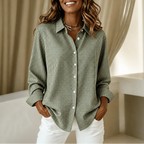 Women's checked button-down shirt with pointed collar, long sleeves and curved hem